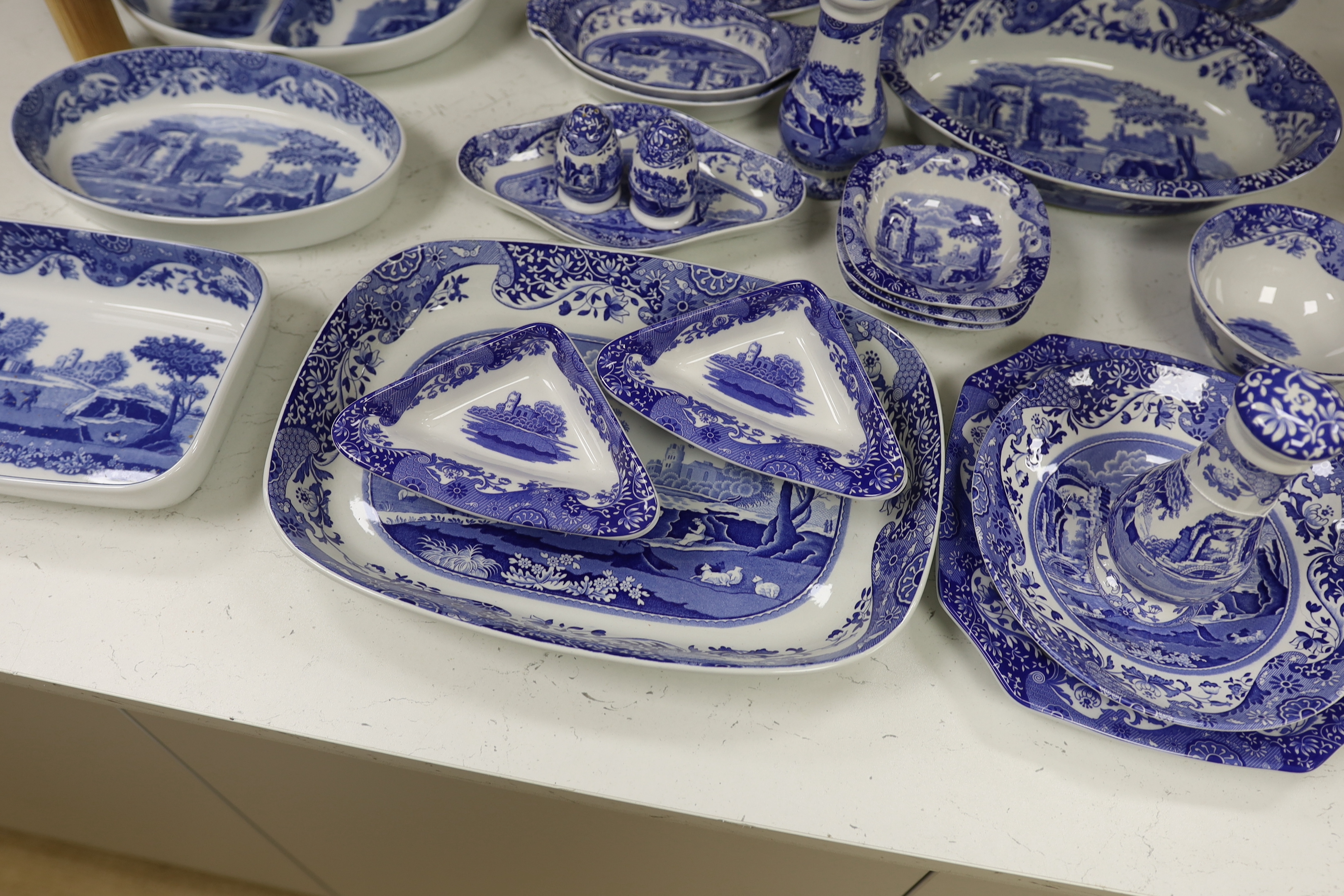 A collection of Spode Italian blue and white various sized serving dishes, cruets etc